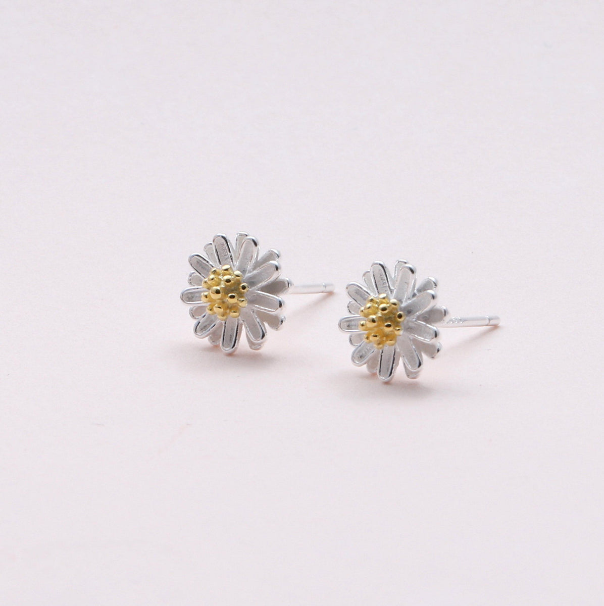 Silver daisy stud sales earrings